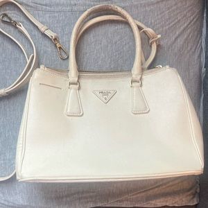 100 % authentic Prada crossbody Saffiano bag. Size Small. Color white.